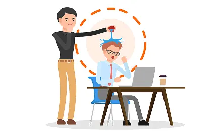 Man in business attire pointing at seated man wearing glasses at desk with laptop, illustrating workplace mentoring or feedback